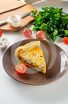 quiche Lorraine with chicken, mushrooms on the table
