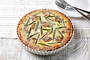 Quiche with mushrooms and asparagus. Homemade french tart consisting of pastry