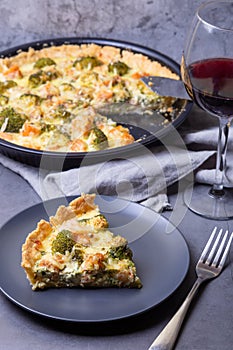 Quiche open pie with trout, broccoli and cheese. Homemade unsweetened pastries, traditional pie.