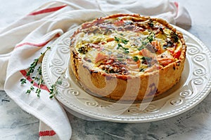 Quiche with salmon, broccoli,red pepper and thyme.