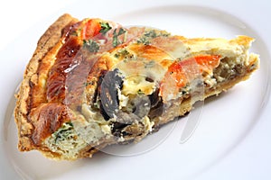 Quiche slice on a white plate