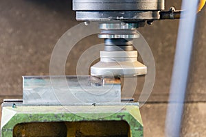 A quick-cutting mill with rapid soldering makes metal removal on a CNC machine, chips flies to the sides photo