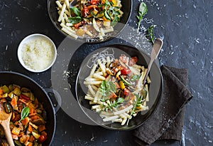 Quick ratatouille pasta. Delicious vegetarian healthy food concept. On a dark background