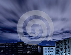 Quickening sky over city buildings