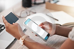 The quickest way to get the bills paid. an unrecognisable businesswoman using a smartphone and credit card at her desk