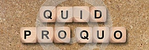 Quid pro quo printed on wooden cube photo
