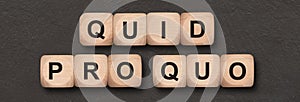 Quid pro quo written on wooden cube