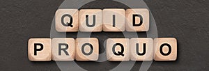 Quid pro quo written on wooden cube photo