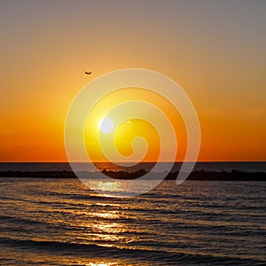 Quiet beautiful golden sunset on the sea. Summer nature background