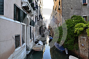 Tied up boats on quiet Venice canal