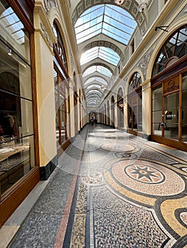 The ancient tiled floor of the Galerie Vivienne on a quiet day, Paris, France