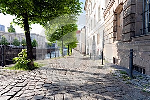 Quiet empty side street in historic district, along a river, on a spring afternoon - Berlin, Mitte, 2018