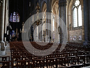 Empty rows of chairs inside Reims Cathedral interior