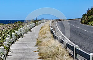 Quiet and peaceful coast road and wooden boardwalk near Wellington, New Zealand