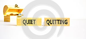 Quiet quitting symbol. Concept words Quiet quitting on wooden blocks. Beautiful white table white background. Wooden chest with