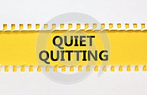 Quiet quitting symbol. Concept words Quiet quitting on yellow and white paper. Beautiful yellow and white background. Business and