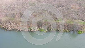 quiet river bank with two houses