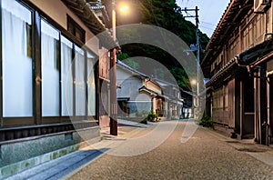 Quiet road through deserted village and traditional buildings