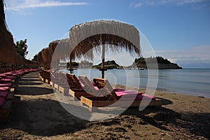 Quiet Sandy Beach With Umbrella And Beach Chair