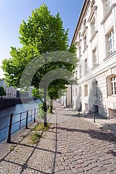 Quiet street in historic district, along a river, on a spring afternoon - Berlin