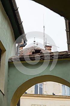 Quiet street, leaving the Fortress Square in the castle of old city. Sighisoara Ñity in Romania