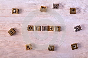 Quiet word metal block photo