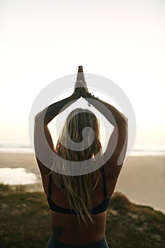 The quieter you become, the more you hear. an unrecognizable woman standing alone and meditating during a relaxing day