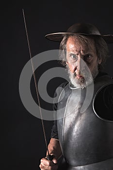 Quijote. Old bearded warrior with breastplate and helmet photo