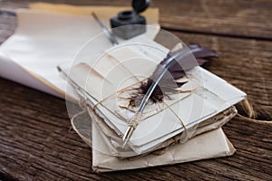 Quill feather with legal documents arranged on table