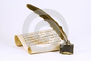 Quill, the inkwell and the scroll with musical notation