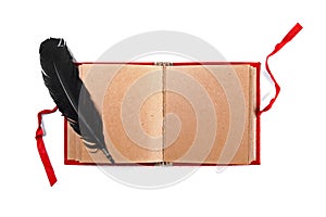 Quill on old blank book isolated on white