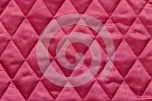 Quilted red satin fabric