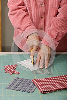 Quilter cutting fabric