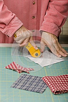 Quilter cutting fabric