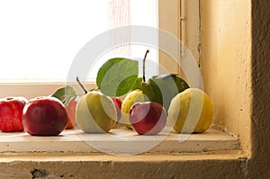 Quince and apples on the window sill photo