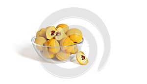 Quince in a transparent bowl isolated on a white background. Yellow ripe fruit. Copy space. Fresh organic food