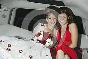 Quinceanera Sitting With Mother In Limousine