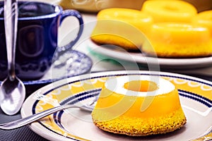 Quindim or Brisa do Lis, typical sweet from Brazil and Portugal, made with egg yolks, almonds or grated coconut photo