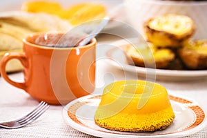 Quindim or Brisa do Lis, typical sweet from Brazil and Portugal, made with egg yolks, almonds or grated coconut photo