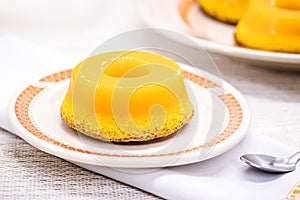 Quindim or Brisa do Lis, typical sweet from Brazil and Portugal, made with egg yolks, almonds or grated coconut photo