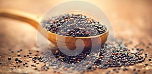 Quinoa. Black grains in a wooden spoon. Dieting concept. Seeds of Black quinoa - Chenopodium quinoa