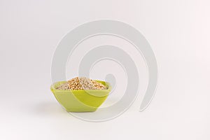 Quinoa in ceramic cup isolated on white background