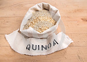 Quinoa flakes in a fabric bag with stencilled name
