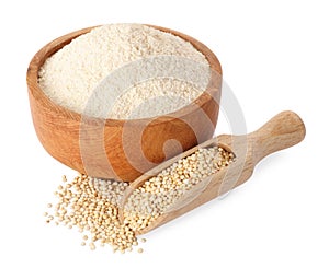 Quinoa flour in wooden bowl and scoop with seeds on white background