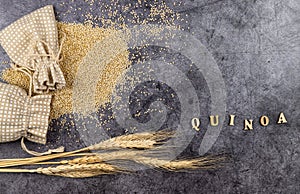 quinoa, grain crop. kinwa grains poured out of a bag on a dark background. Chenopodium quinoa. upper view
