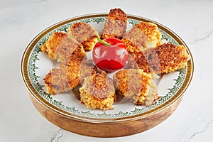 Quinoa pancakes with stuffed tomato on plate