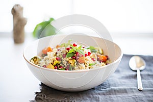 quinoa and roasted brussels sprouts bowl with pomegranate seeds