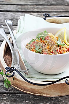 Quinoa salad with vegetables,herbs and lemon.