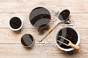 quinoa seeds in bowl and spoon on colored background. Healthy kinwa in small bowl. Healthy superfood