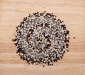 Quinoa seeds on a wooden background